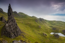 The Old Man of Storr on the Skye island, Scotland, UK. To understand its size, keep in mind that the little white dots at the basement are sheeps